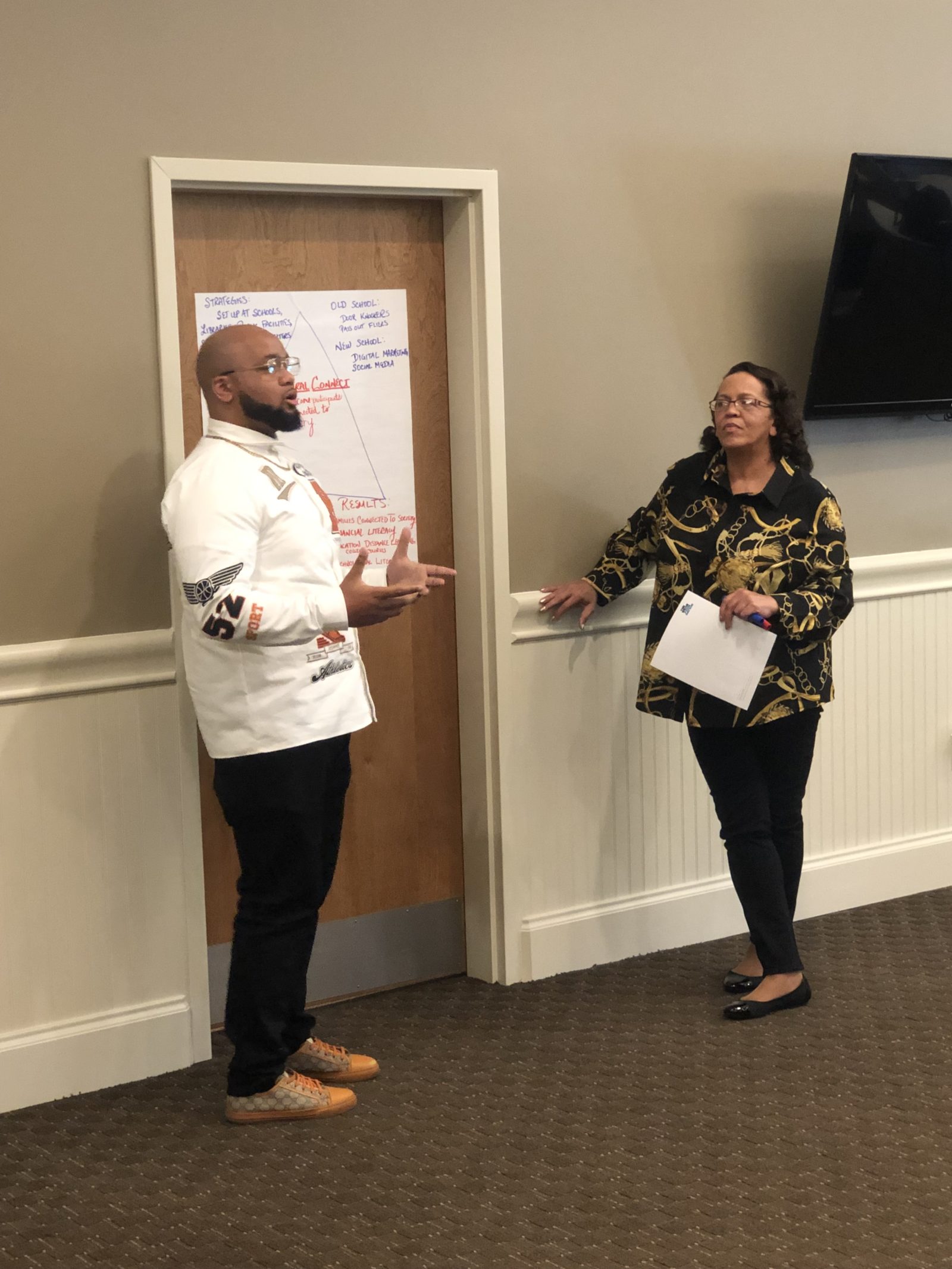 Lester Scott II (L.) and Shauna Barry-Scott from Dare to Dream Children’s Foundation participate in an exercise during the grantee orientation at The Raymond John Wean Foundation on Thursday, April 28. Grants were awarded to eight grassroots groups in Warren and Youngstown through Neighborhood SUCCESS Grants, a program of the Wean Foundation.